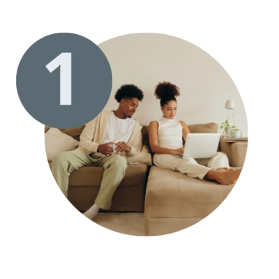 smiling woman and man using a laptop with the number 1