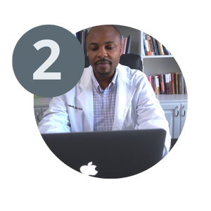 Dr Thurmond Lanier holding a podiatry telehealth visit on an Apple computer